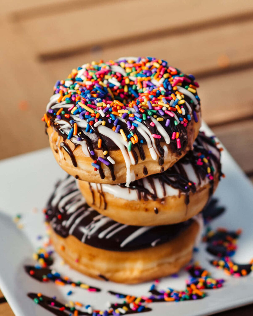 Colorful Doughnuts with Sprinkles and Icing - Tasty Wallpaper Background