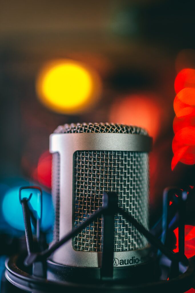 Vibrant Studio Microphone Wallpaper with Colorful Bokeh Background