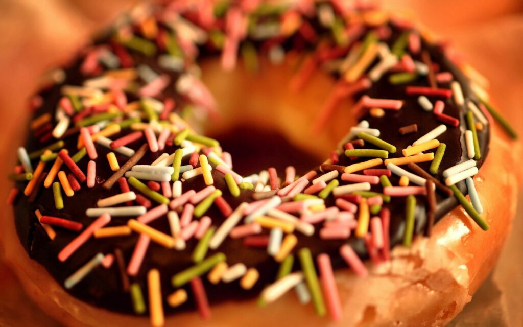 Vibrant Donut Close-Up: Sweet Treat Wallpaper Background