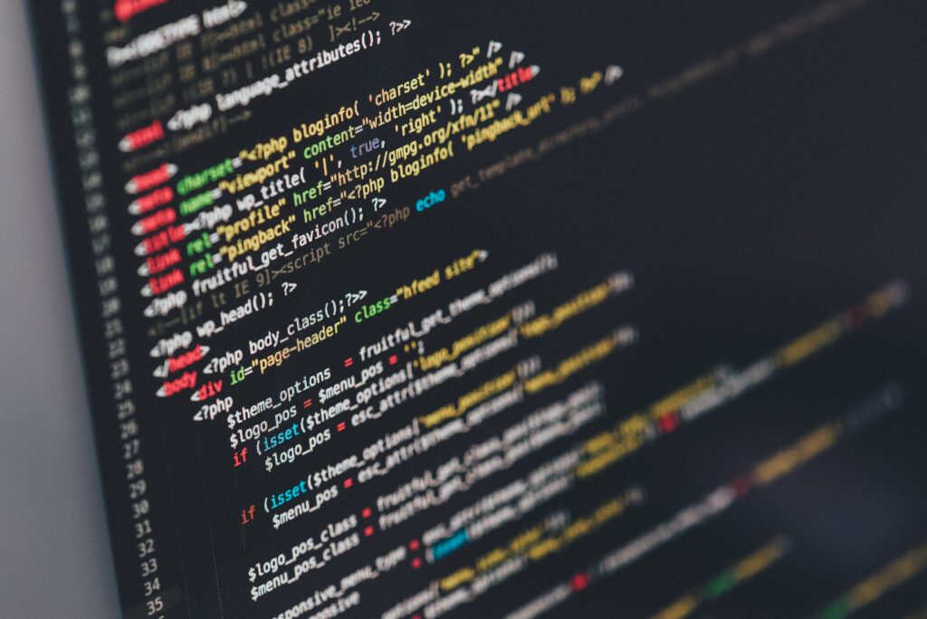 Colorful Code Wallpaper - Close-Up of Syntax on Black Screen