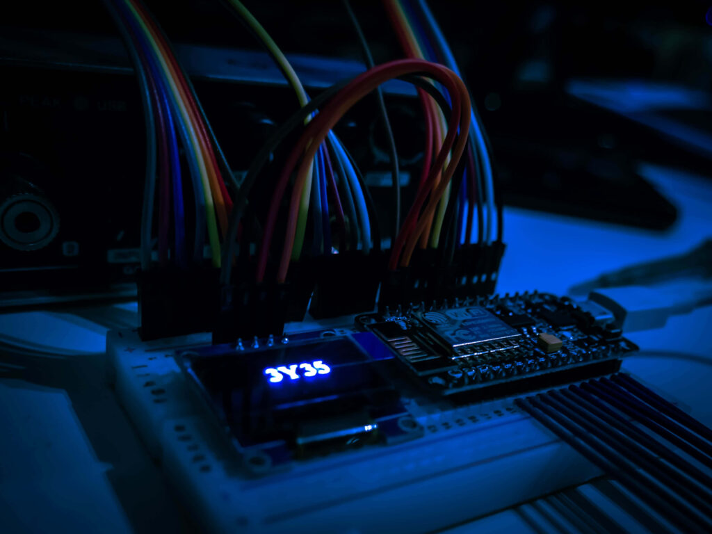Vibrant Tech Wallpaper: Colorful Cables & Glowing Circuit Board