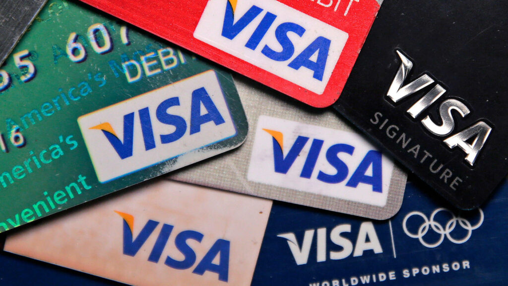 Close-up of colorful Visa credit and debit cards stack showcasing diverse payment designs Wallpaper