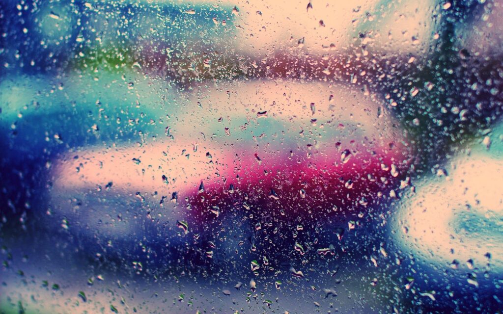 Vibrant Water Droplets Wallpaper with Colorful Light Reflections