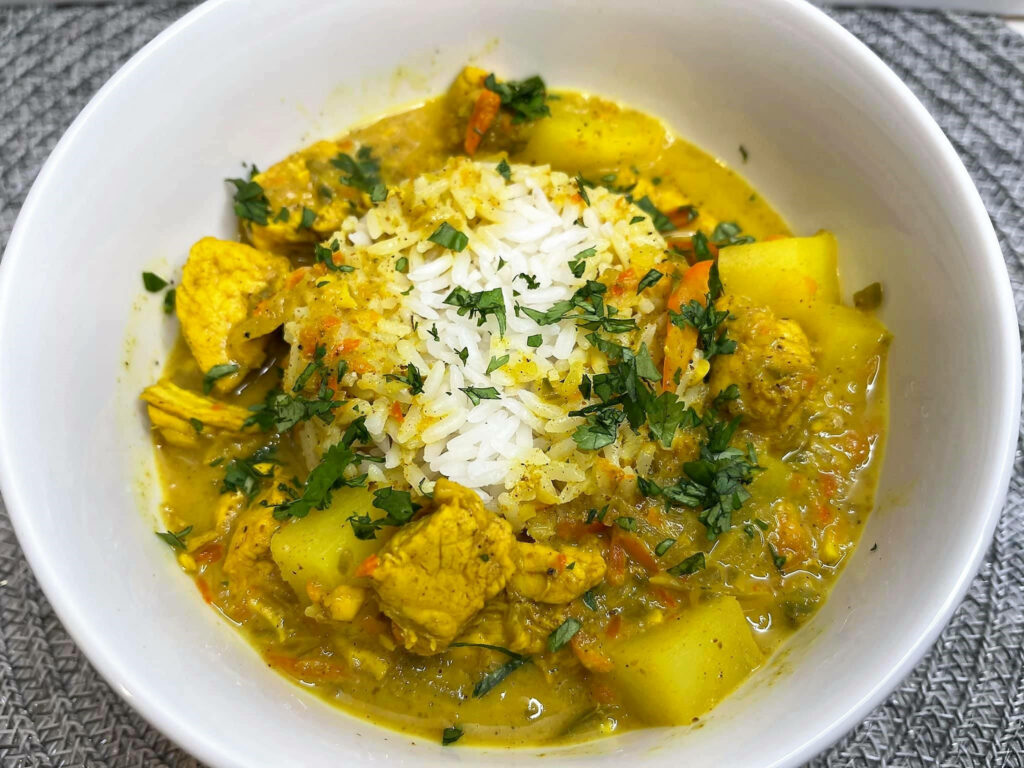 Vibrant Yellow Curry Rice Bowl: Flavorful Wallpaper Background