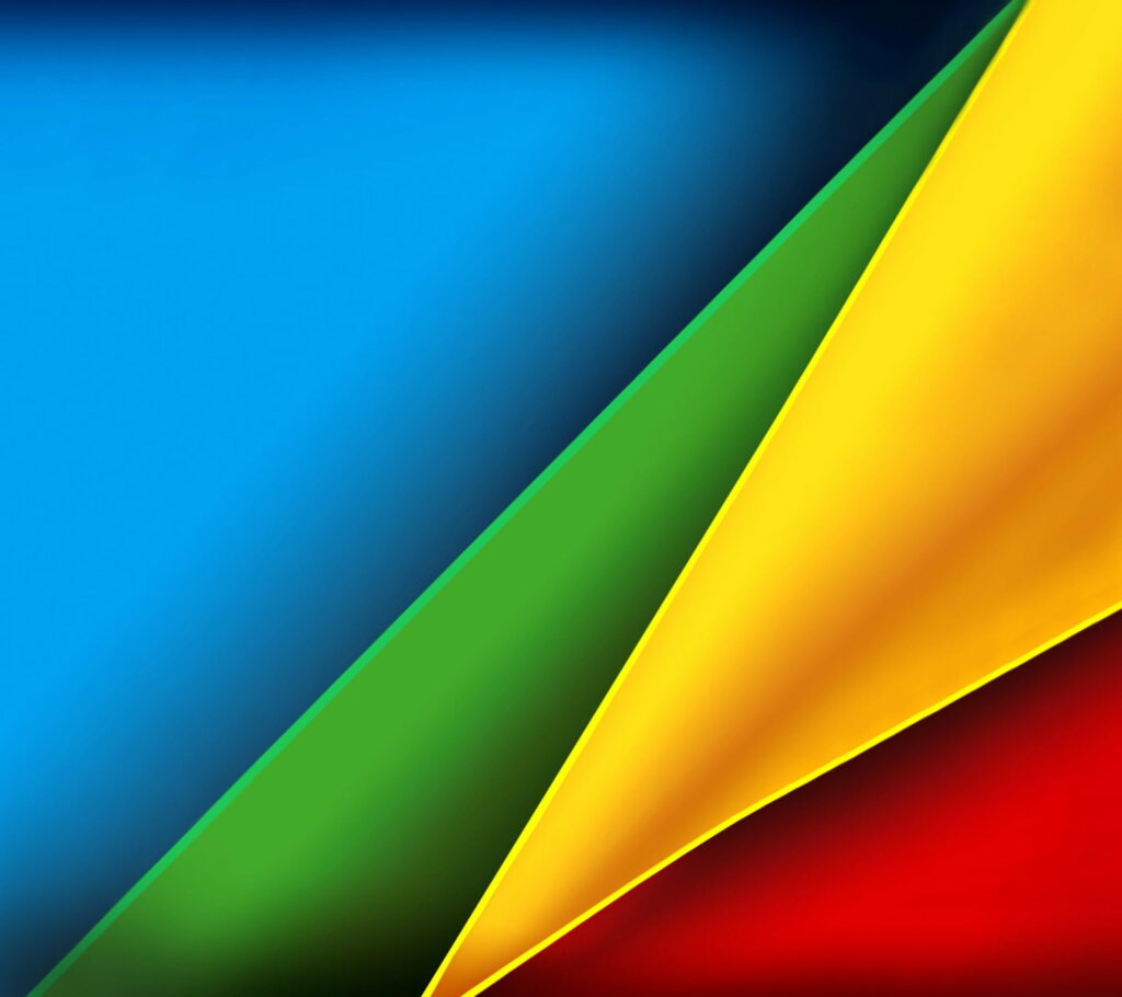 Abstract geometric wallpaper design with colorful overlapping triangles blue green yellow red