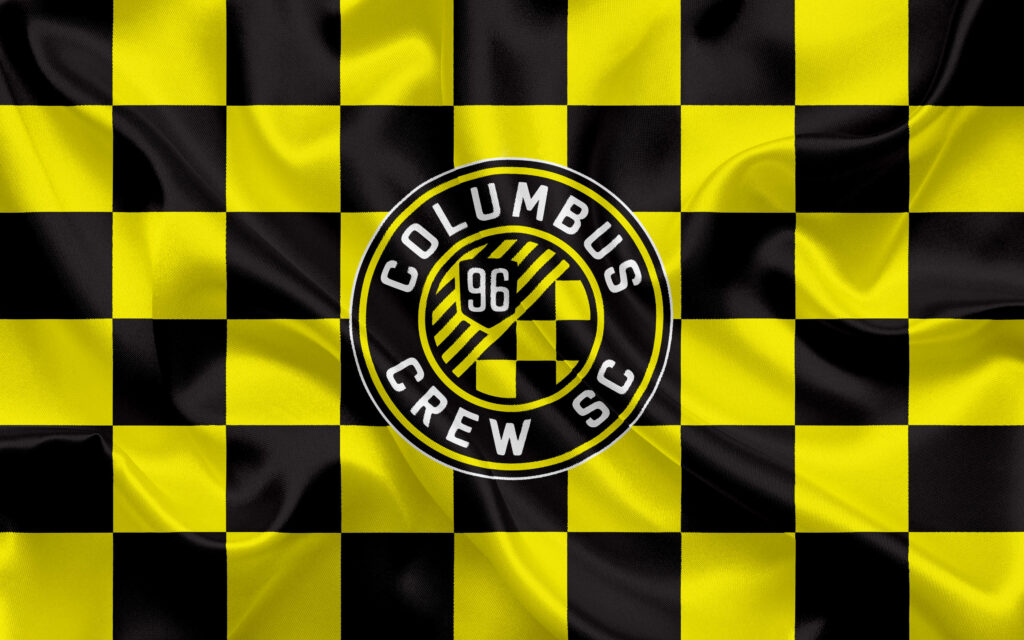 Columbus Crew SC flag wallpaper with black yellow checkerboard and central team crest design