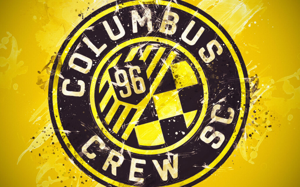 Columbus Crew SC logo wallpaper with gritty yellow black splatter urban texture design background