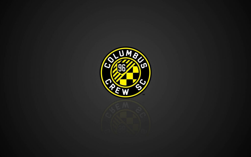 Columbus Crew Soccer Club logo on black background with yellow white crest and geometric patterns Wallpaper