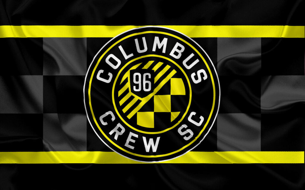 Columbus Crew soccer team flag wallpaper with black checkered background and bold yellow stripes