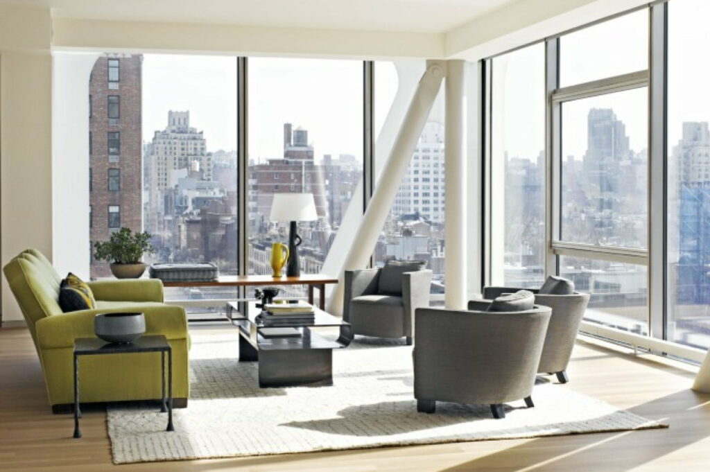 Comfy Haven: An HD Wallpaper Showcasing a Cozy Sofa in a Beautifully Furnished Room