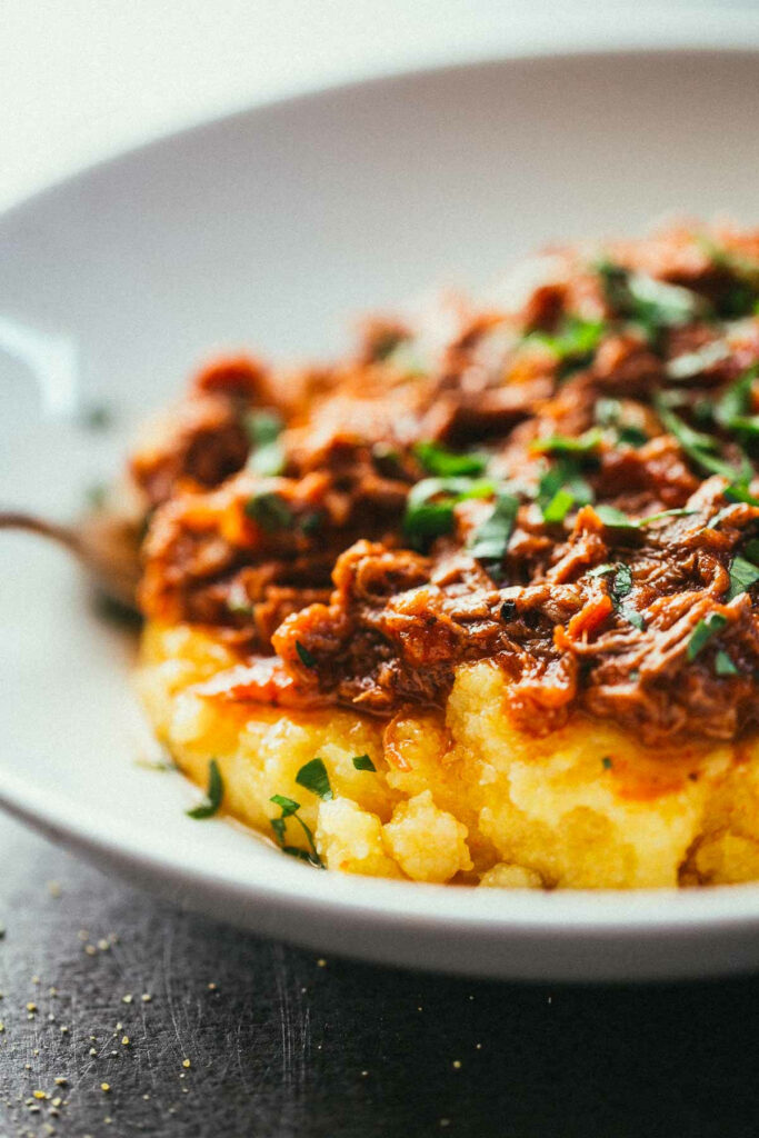 Comforting Crockpot Braised Beef Ragu on Creamy Polenta Wallpaper