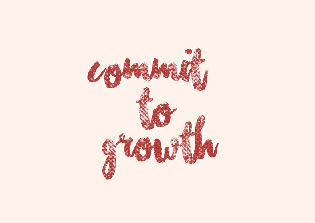 Motivational wallpaper with handwritten commit to growth text in deep red on pale pink background