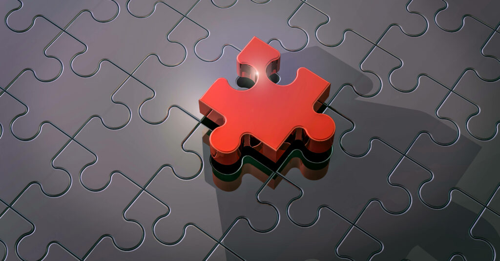 Glossy red 3D jigsaw puzzle piece fitting into matte black puzzle on sleek dark background Wallpaper