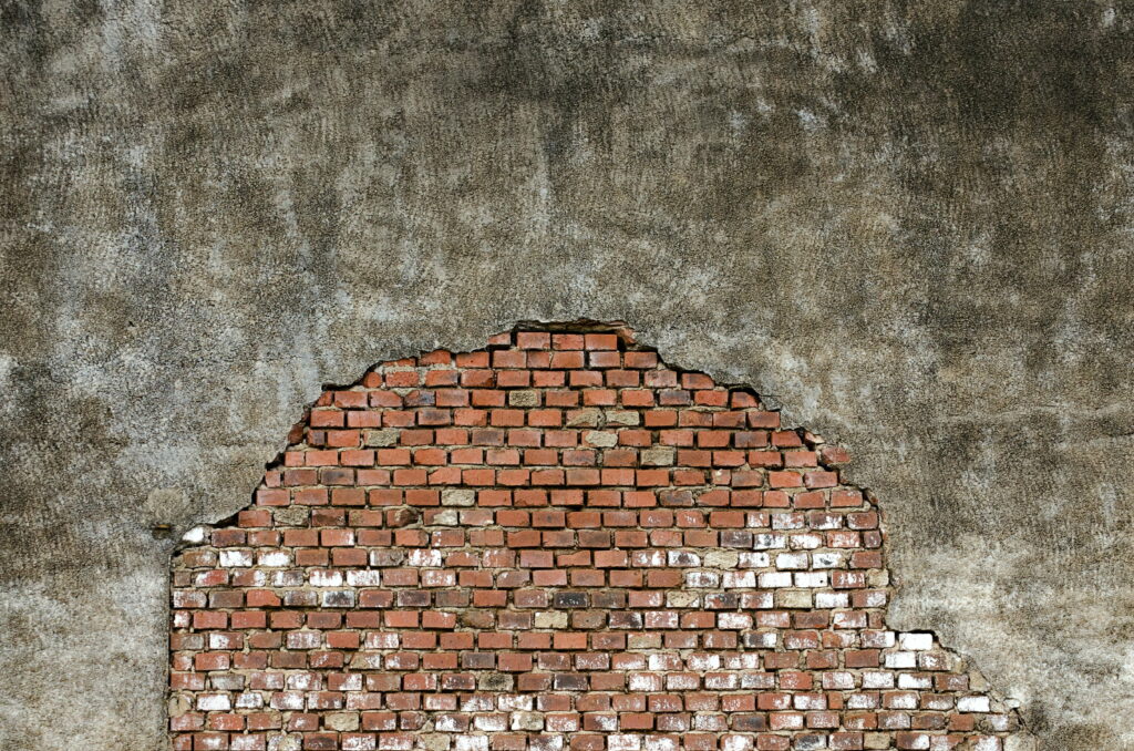 Majestic Concrete Fortress: An Aesthetic 4K Wallpaper of a Textured Brick Wall