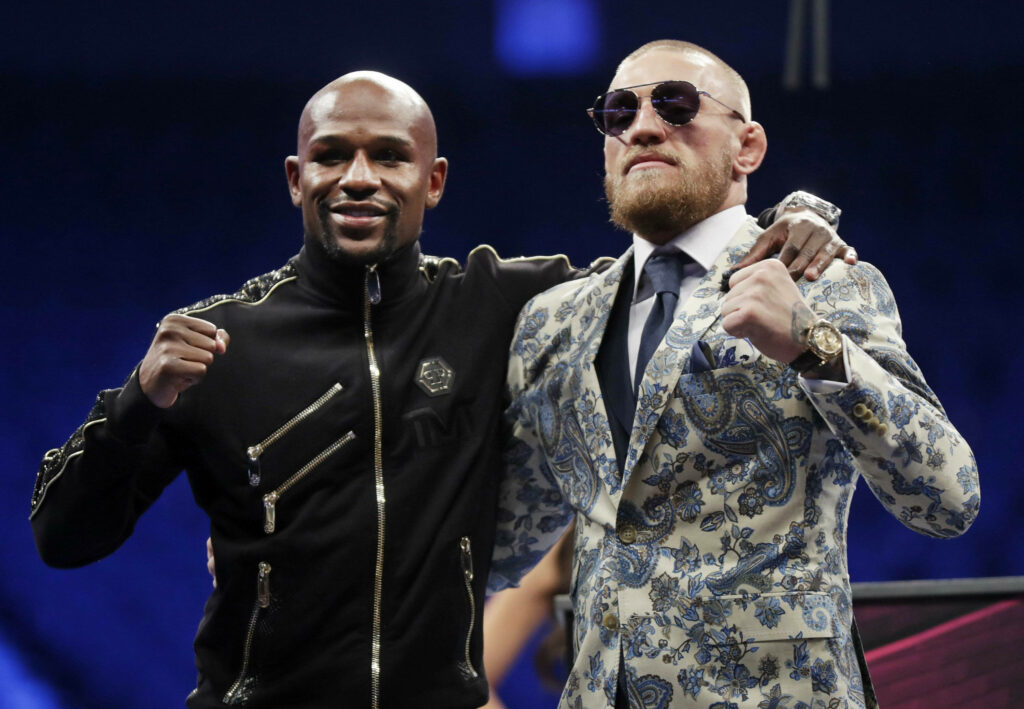 Iconic Conor McGregor & Floyd Mayweather Wallpaper: Confident Duo