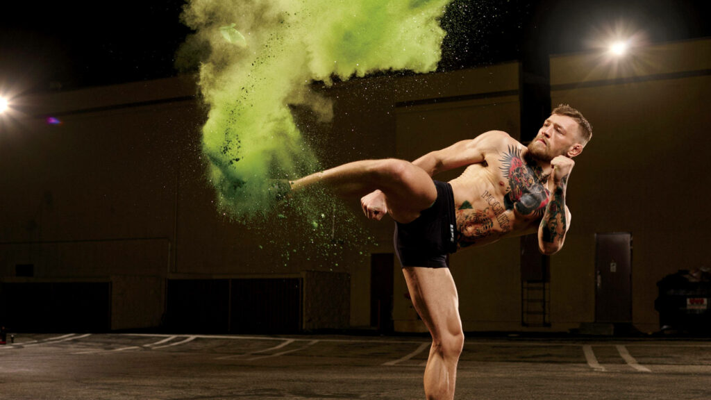 The Notorious Kick: Conor McGregor Strikes a Pose in Stunning Park Wallpaper