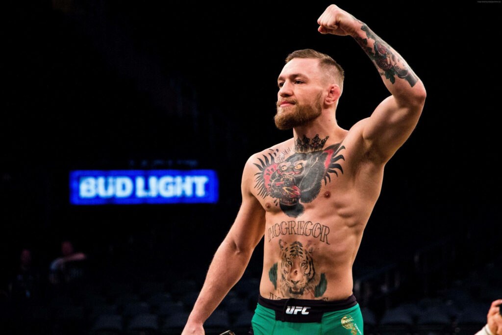 Conor McGregor's Powerful Fight Pose - 4K Tattoo Wallpaper for UFC Fans
