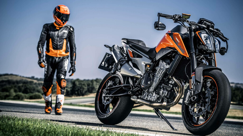 Revving up in 4K: Rider on a Stunning KTM Background Wallpaper
