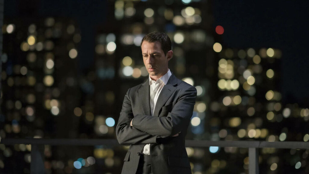 Contemplative Kendall Roy Wallpaper: Intense City Lights Backdrop