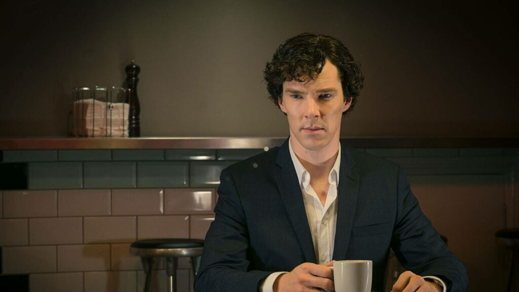 Contemplative Sherlock in a Dim Café - Cozy Wallpaper Background