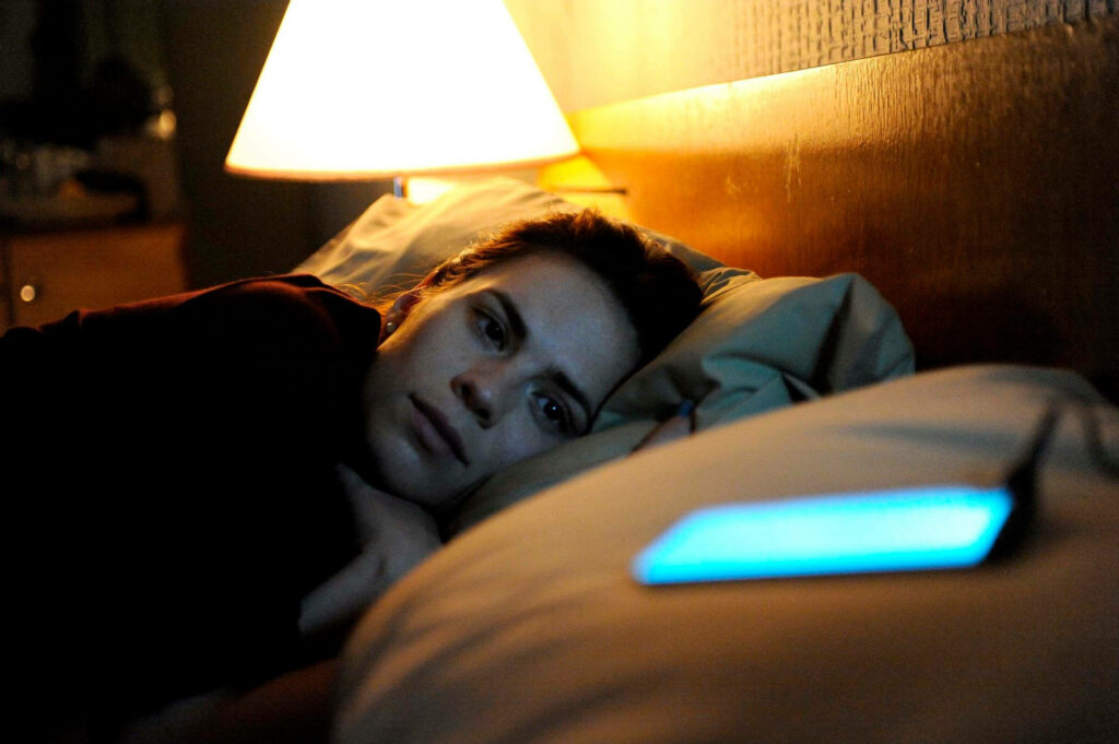 Contemplative Moment in Black Mirror: Be Right Back - Phone Light Wallpaper