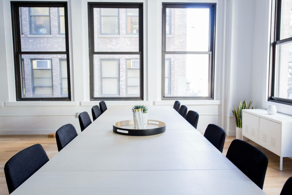 Modern Black and Sleek: Transform Your Zoom Office with a Sophisticated Conference Room Wallpaper