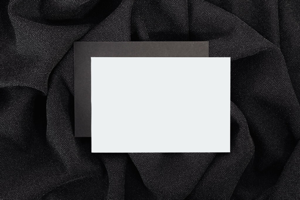 Contrasting Textures: Black Textile with White Paper Elegance Wallpaper