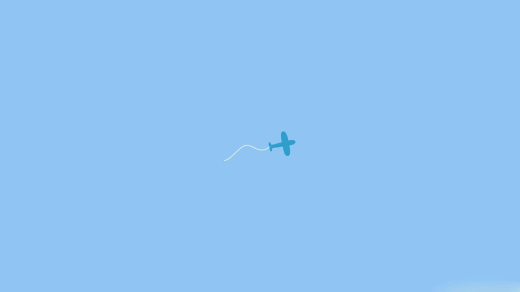 Blending in the Blues: Captivating Contrast of a Darker Shade Plain Blue Plane against a Serene Plain Blue Background Wallpaper