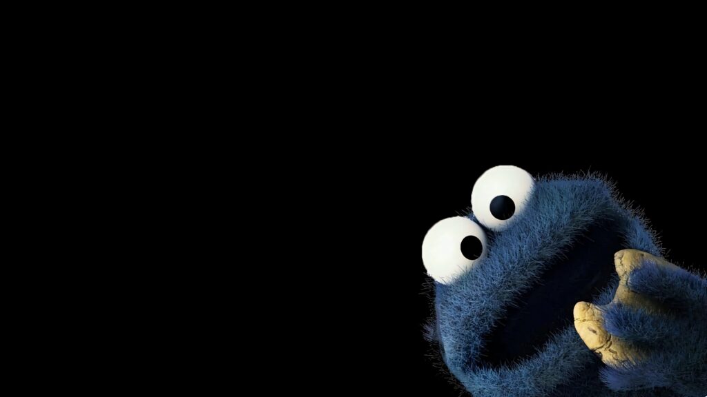 Cookie Monster peeking from corner on black background blue fur googly eyes fun Sesame Street wallpaper