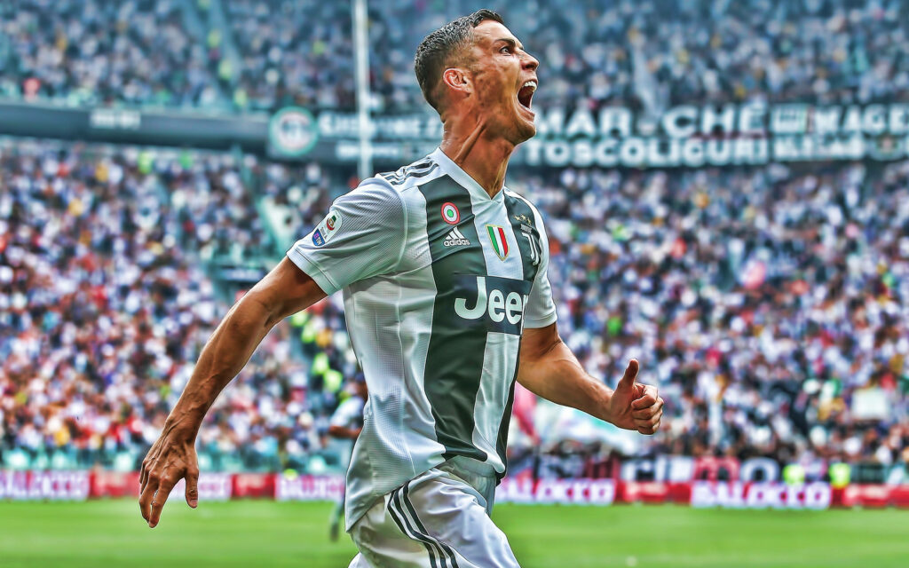 Cr7's Epic Roar: Cristiano Ronaldo's Triumphant Moment Captured in Cool Stadium Background Wallpaper