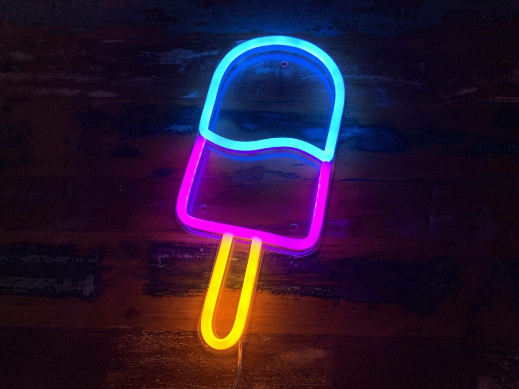 Dazzling LED popsicle shines against a mysterious backdrop Wallpaper