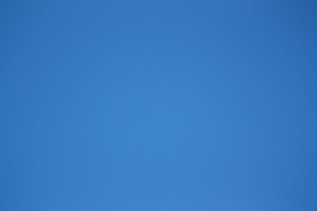 Cool and Calming: Exploring the Tranquil Depths of Steel Blue in a Minimalistic Background Wallpaper