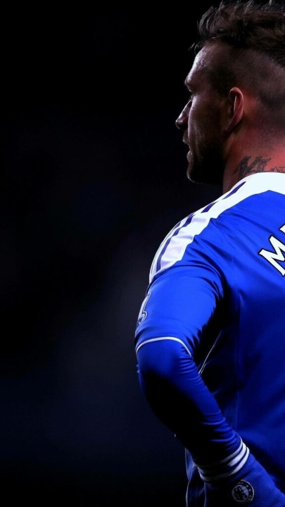 Back Angled Shot Catches Chelsea's Raul Meireles in Iconic Cool Soccer Pose Wallpaper