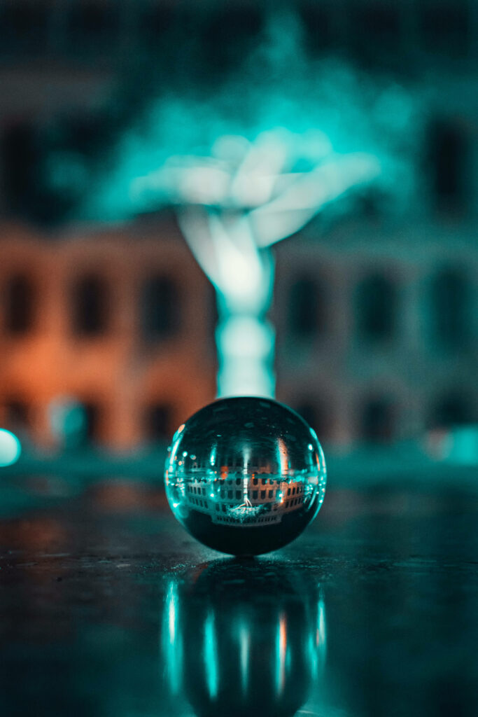 Urban Reflection: Captivating Steel Ball in a Cool-toned Cityscape - 4k HD Mobile Wallpaper