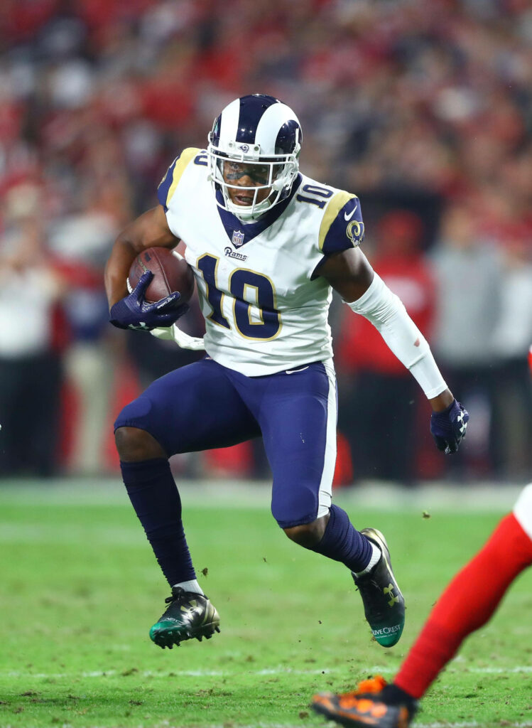 Cooper Kupp NFL Rams sprinting with football intense action game wallpaper background