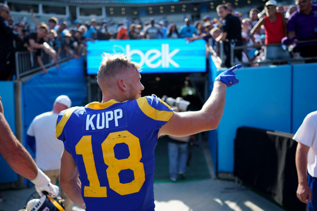 Cooper Kupp LA Rams greets excited football fans near tunnel vibrant NFL game day moment wallpaper
