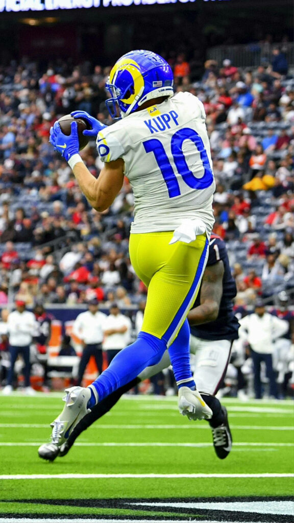 Cooper Kupp LA Rams jumping catch NFL game dynamic action football field wallpaper background