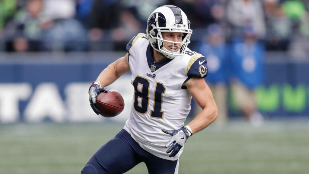 Cooper Kupp Los Angeles Rams running with football focused during game action wallpaper