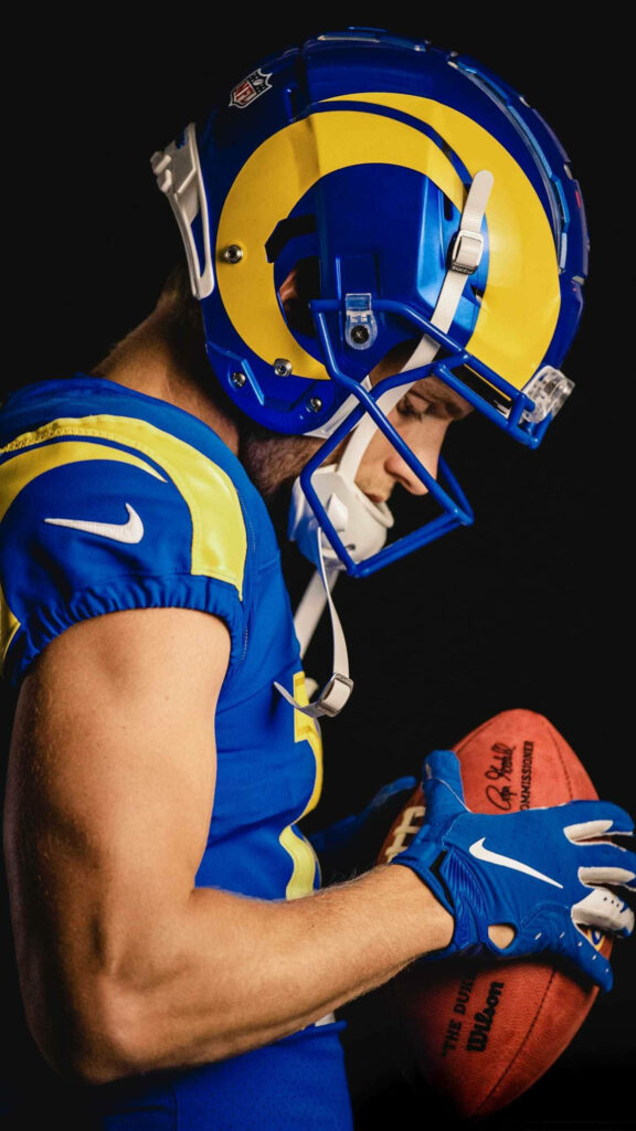 Cooper Kupp Los Angeles Rams focused NFL player holding football dynamic football wallpaper