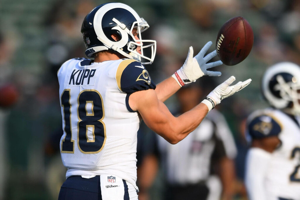 Cooper Kupp Rams NFL catches football in action high resolution intense game moment wallpaper