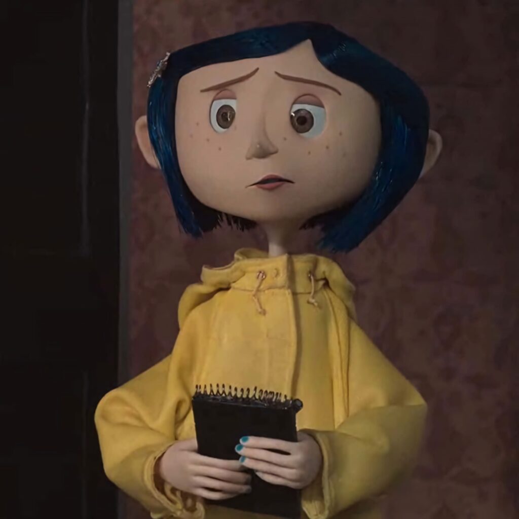 Coraline in yellow raincoat holding notepad against eerie dim stop-motion background wallpaper