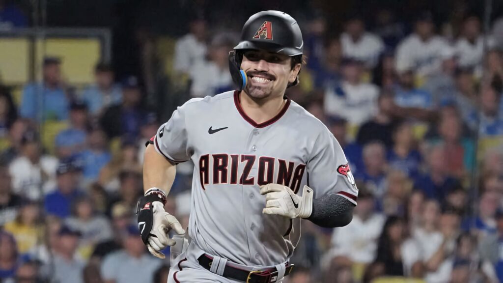 Corbin Carroll Arizona Diamondbacks in action vibrant stadium energy baseball field wallpaper