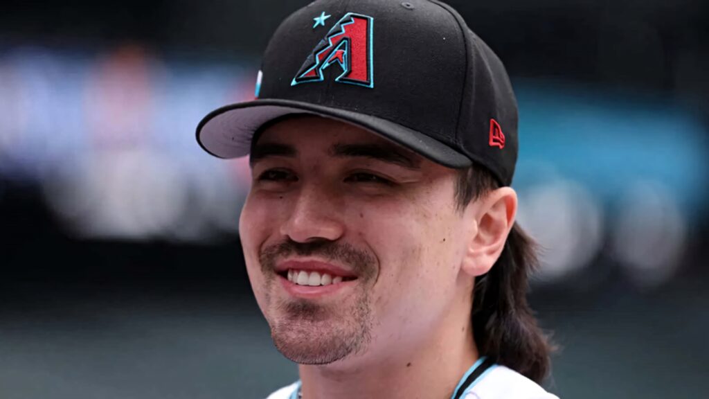 Corbin Carroll close-up portrait wearing Arizona Diamondbacks cap with natural lighting smile Wallpaper