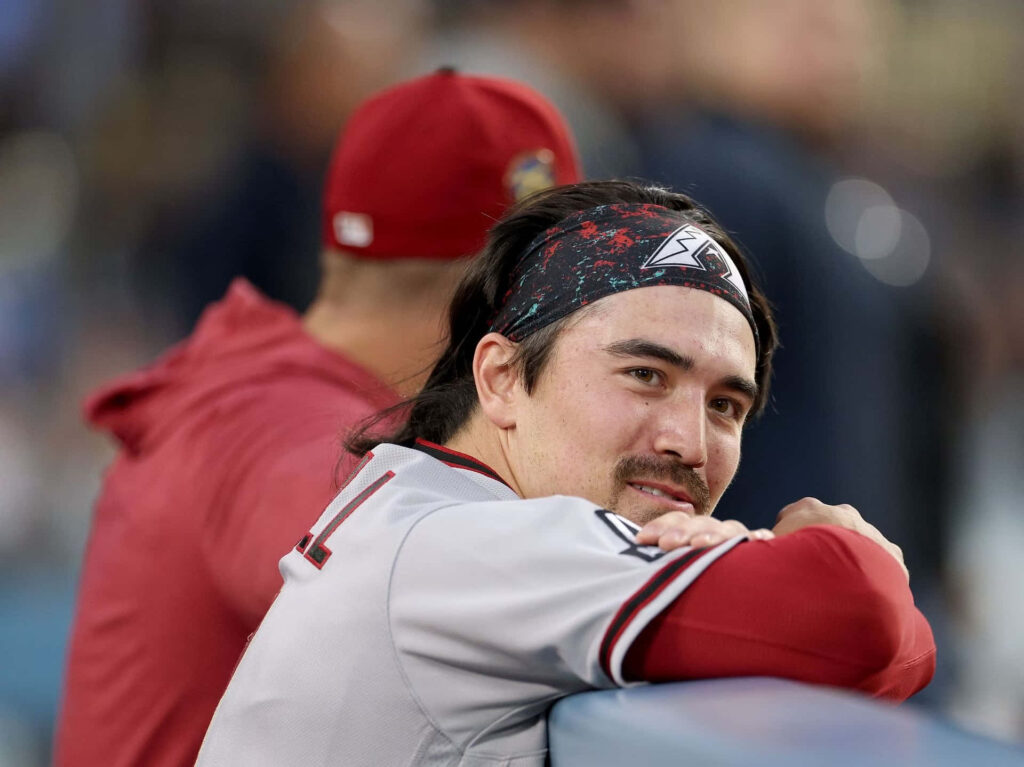 Corbin Carroll Arizona Diamondbacks focused on dugout railing baseball wallpaper background
