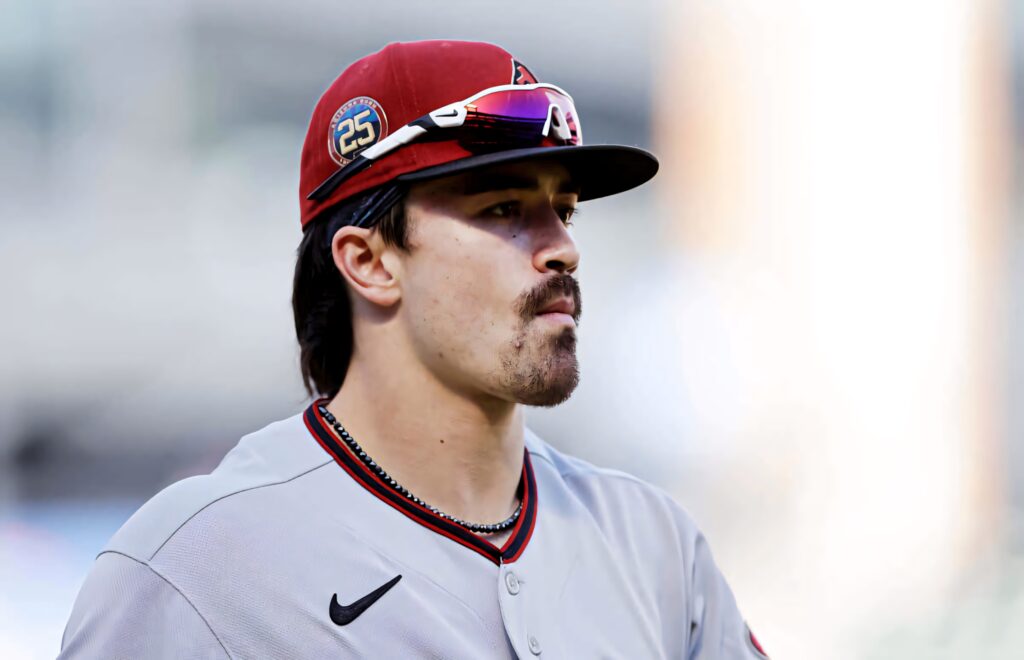 Corbin Carroll in gray Arizona Diamondbacks uniform with red cap and sunglasses baseball wallpaper