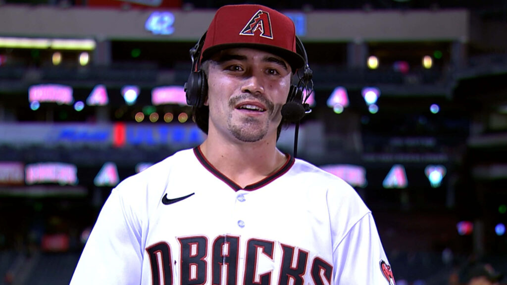 Corbin Carroll Arizona Diamondbacks player post game interview vibrant stadium lights wallpaper