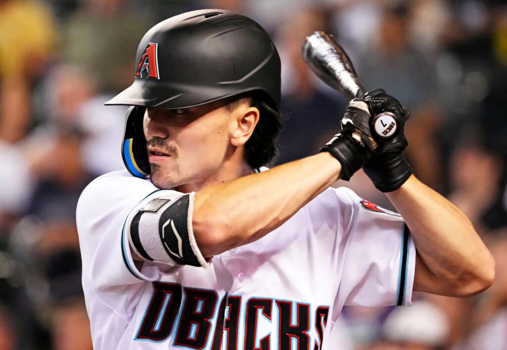 Corbin Carroll Arizona Diamondbacks batter intense focus vibrant uniform MLB action wallpaper background