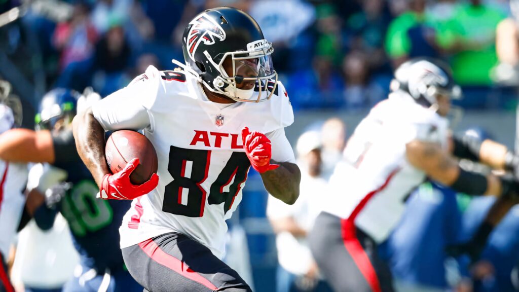 Cordarrelle Patterson Atlanta Falcons intense action run vibrant team colors dynamic football energy Wallpaper