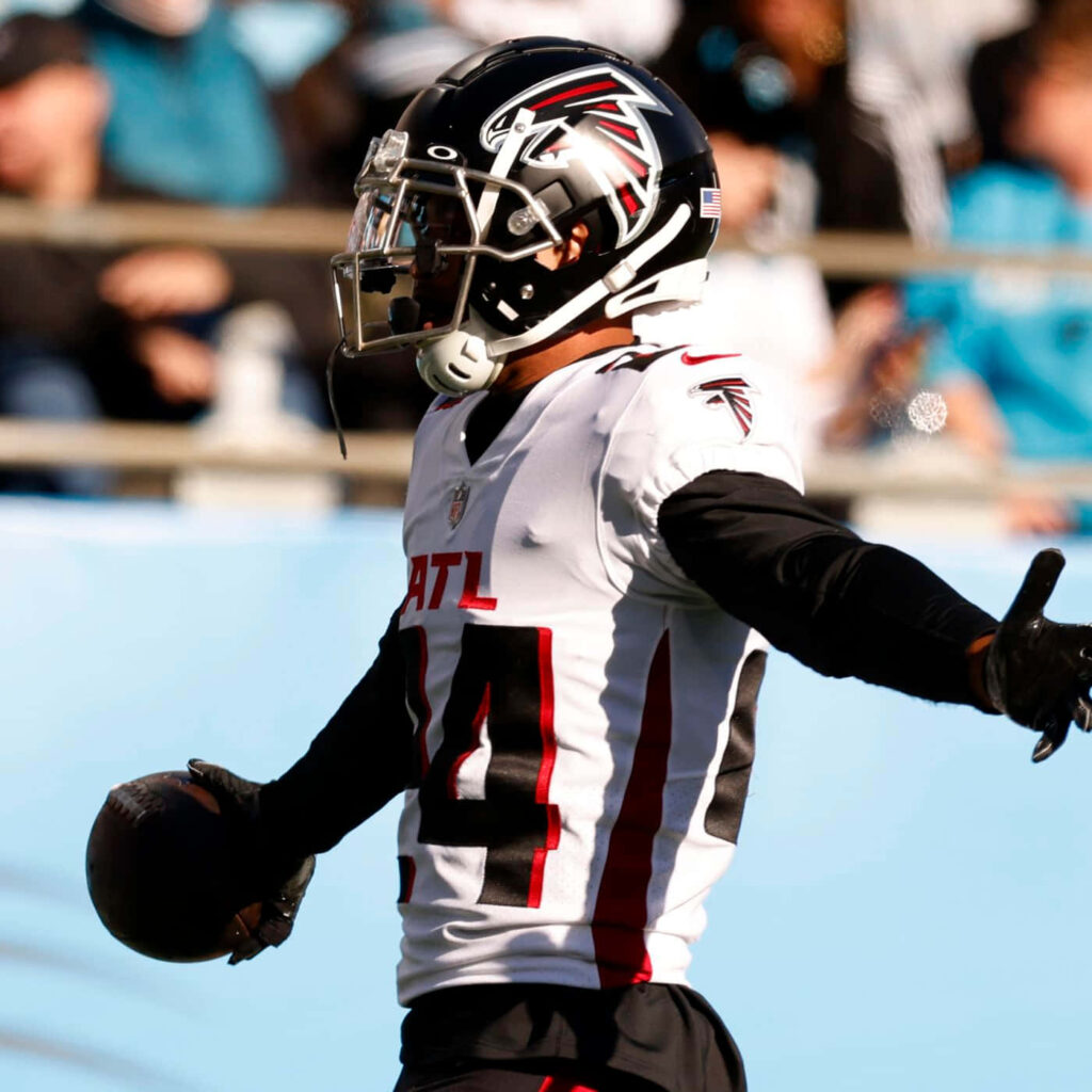 Cordarrelle Patterson Atlanta Falcons celebrating with football in white black red uniform on field Wallpaper