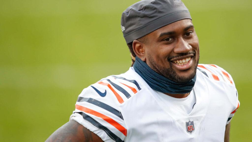 Cordarrelle Patterson smiling in Chicago Bears uniform during practice with green field background Wallpaper